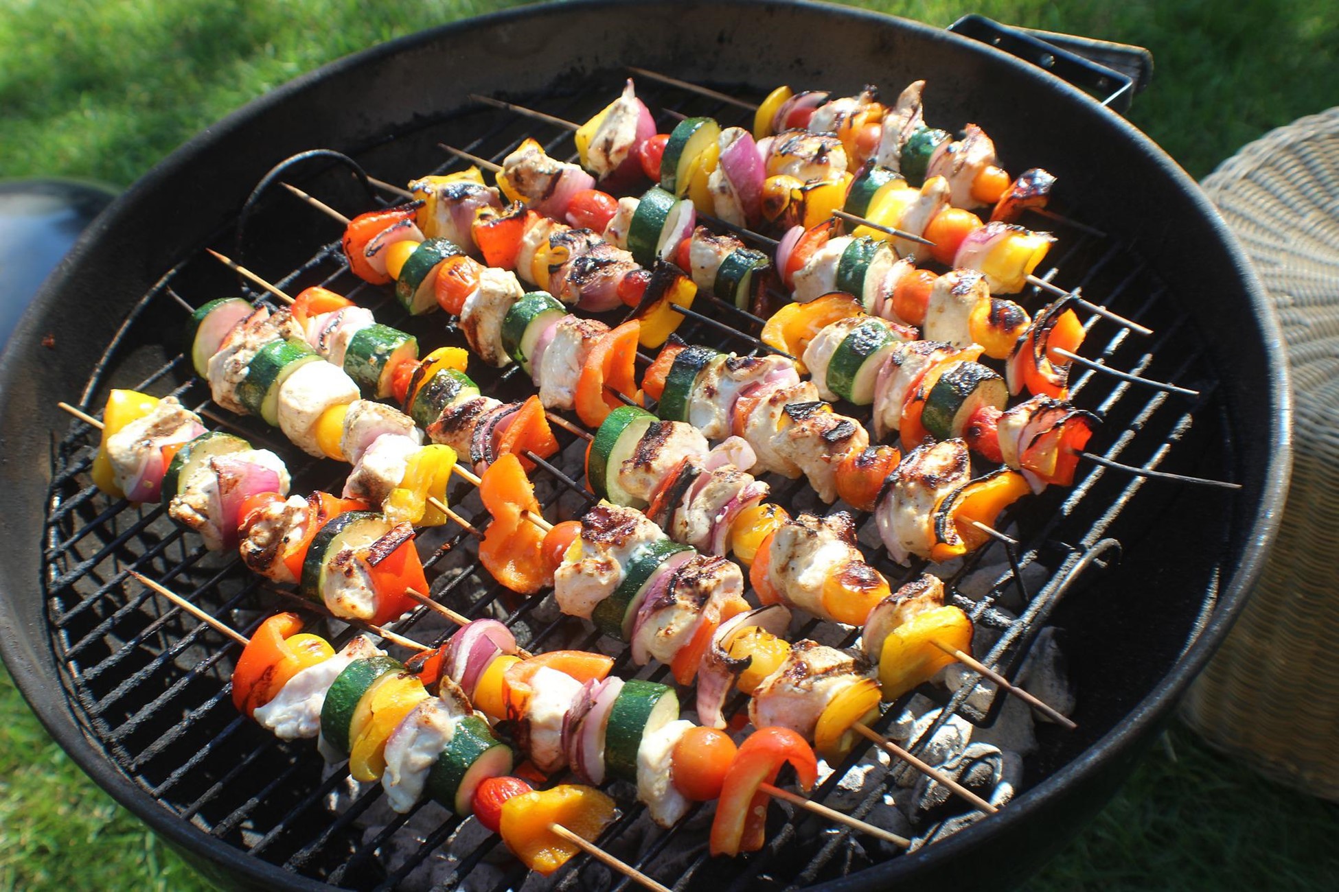 Chicken skewers on the campfire grill.
