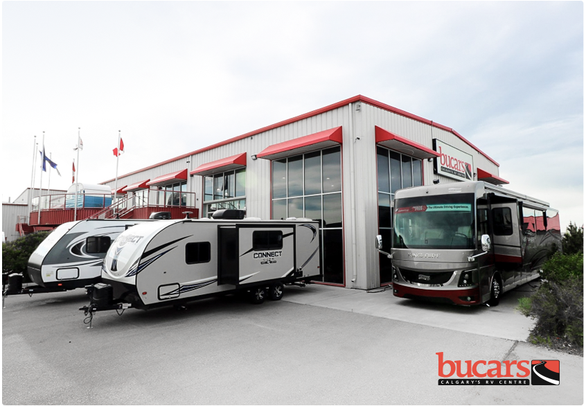 The Bucars dealership with trailers parked in front.